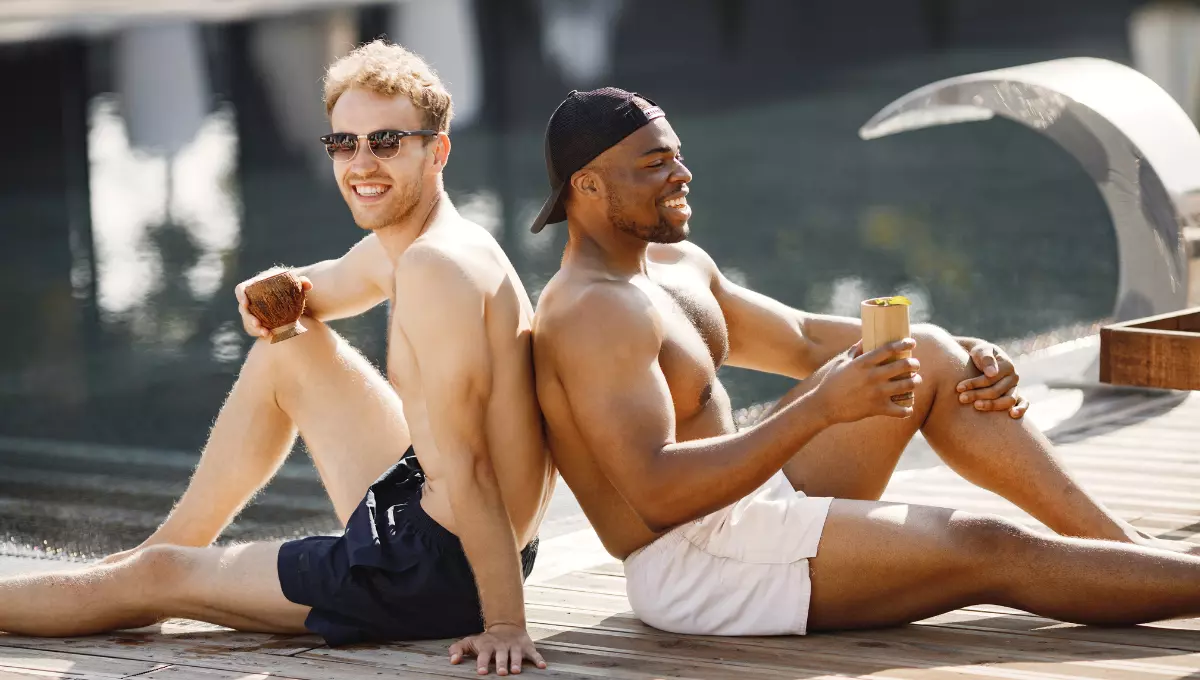Men Sitting beside pool in Bathing suite